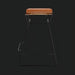 Surya Celerio 25"H counter stool with brown lacquered leather top and gray powder-coated iron base.