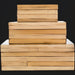 Stacked Surya Cane Garden decorative boxes, natural bamboo and dark brown hand-painted manufactured wood.