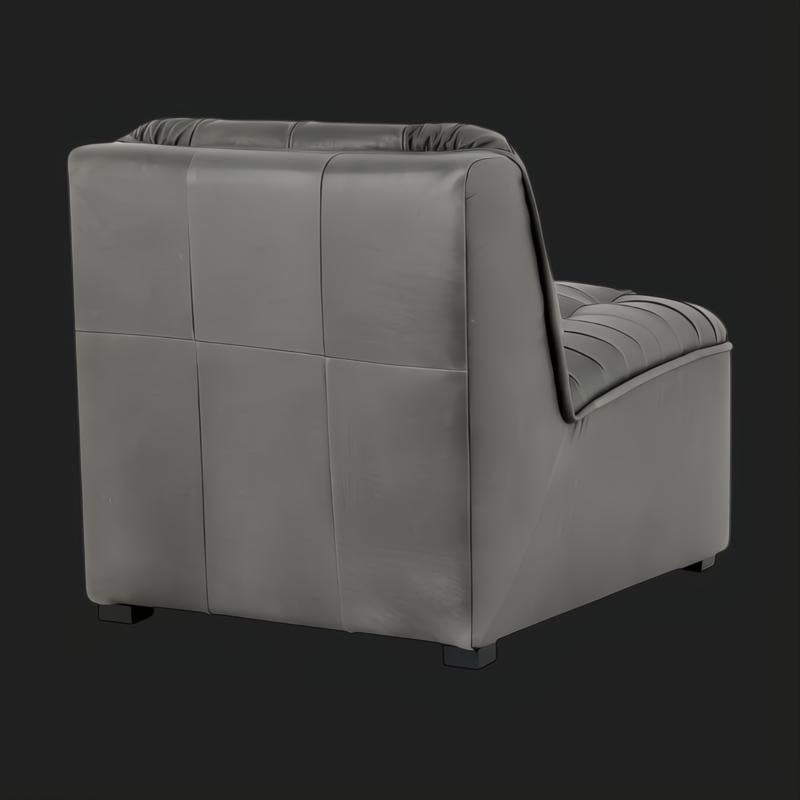 Black 100% leather Surya Oryan modular sofa with pleated cushion and structured back.