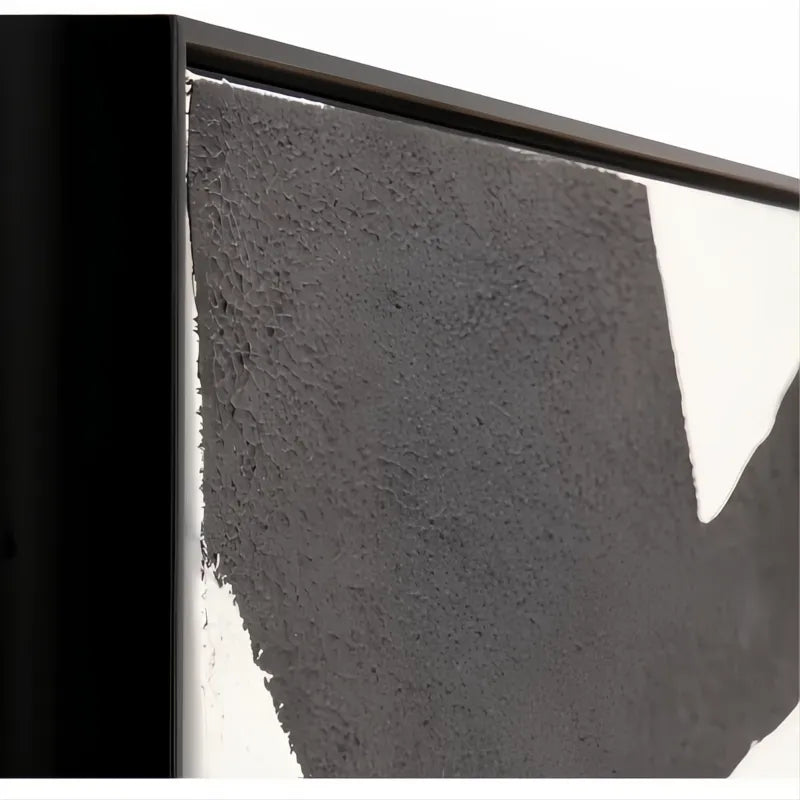 Abstract black and white textured wall art with a sleek black frame, part of the Aasmaa collection.
