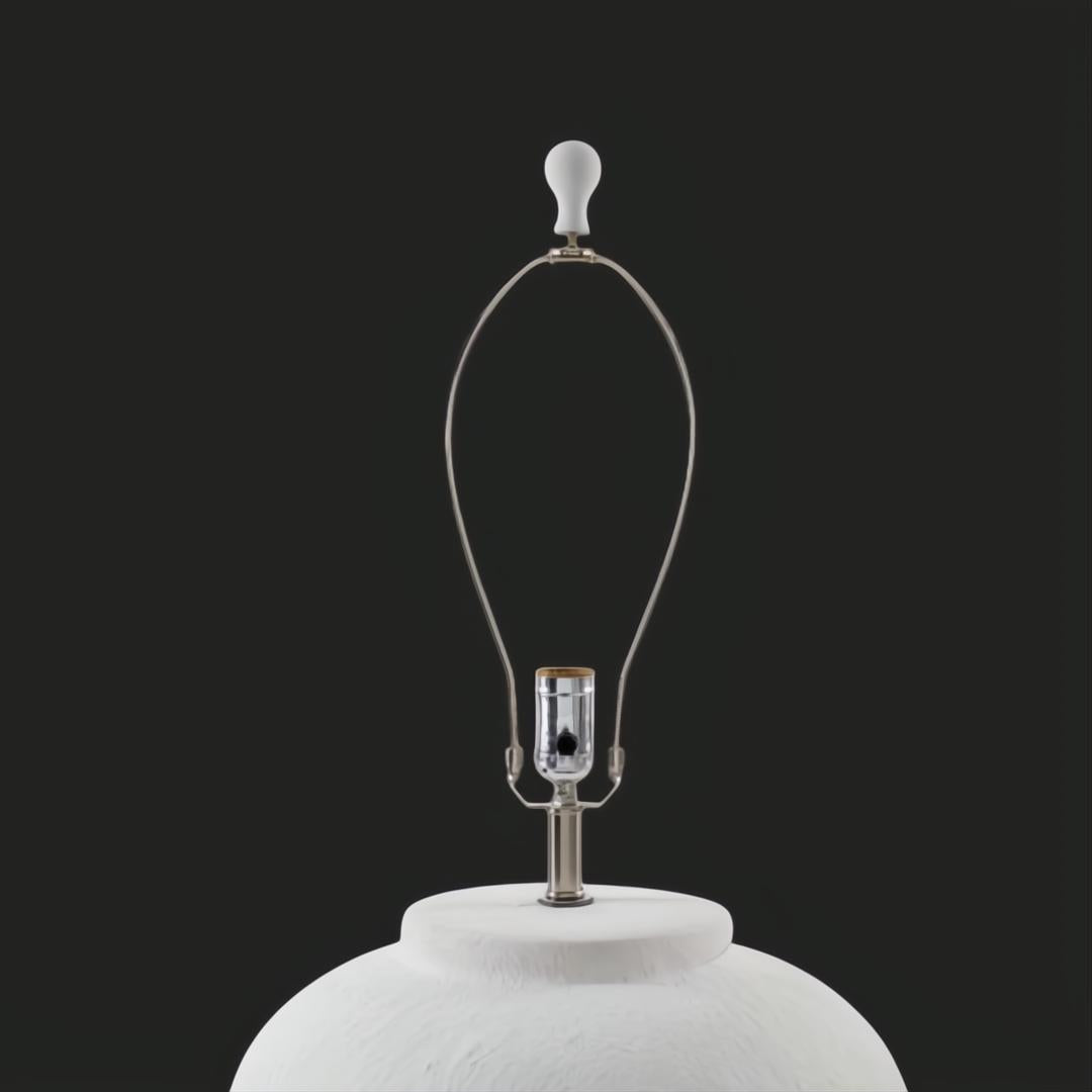 Surya Arion accent table lamp with a textured white ceramic base and metal harp, ready for a shade.