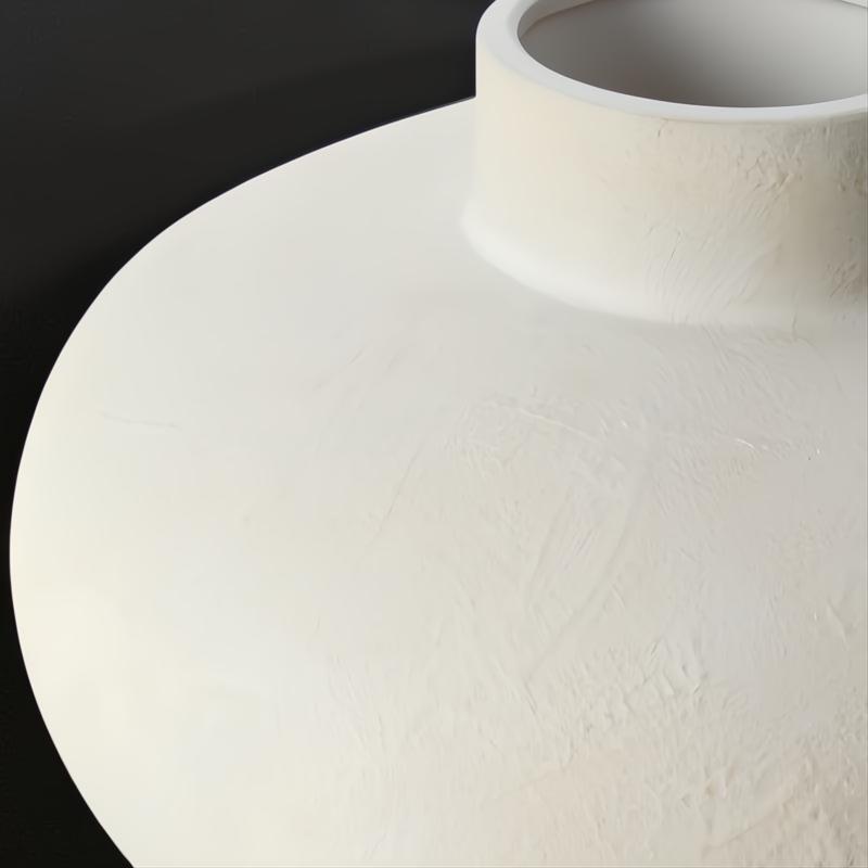 Surya Acanceh modern ceramic decorative accent with a sculptural, vase-inspired design in a light, textured finish.