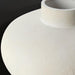 Surya Acanceh modern ceramic decorative accent with a sculptural, vase-inspired design in a light, textured finish.