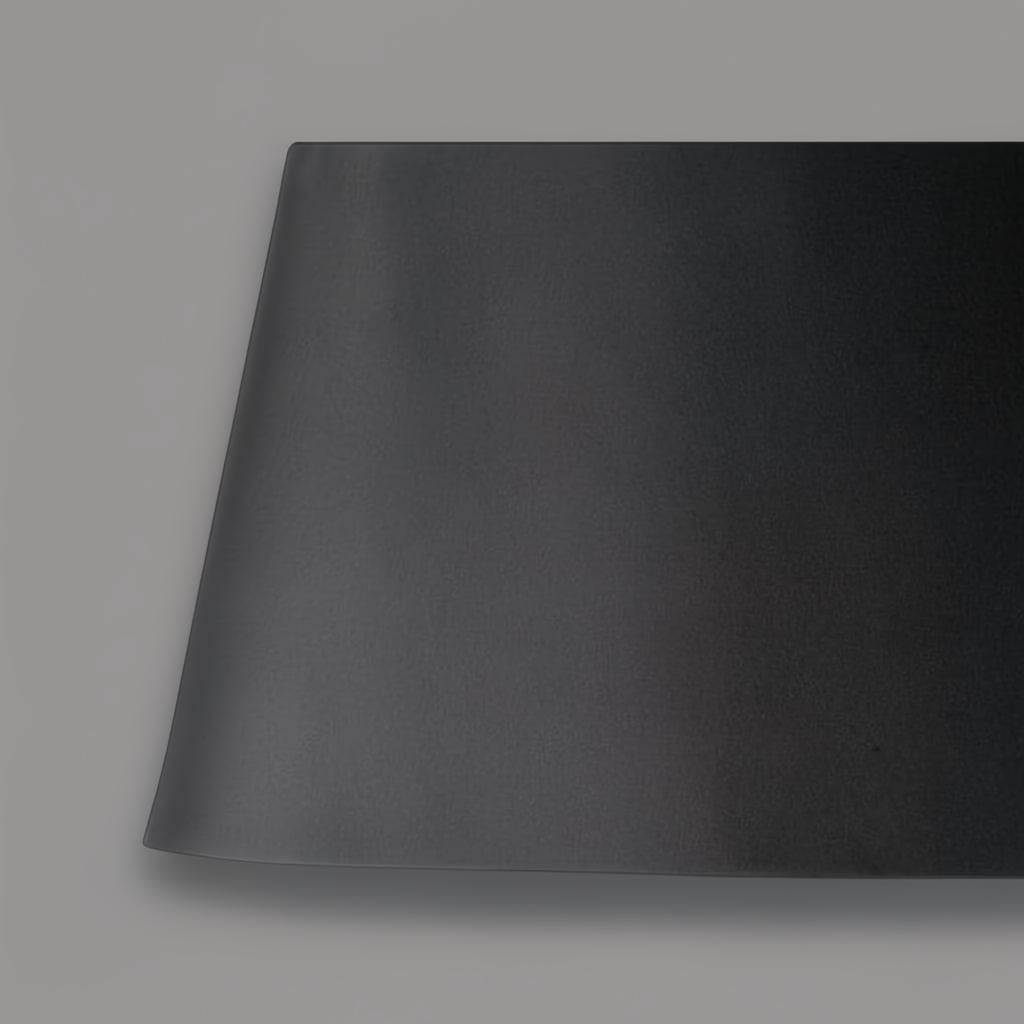Close-up of the Astro Accent Floor Lamp's sleek black polyester shade, showcasing its modern, sculptural design.