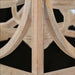 Close-up of the Surya Braylee 4-light chandelier's distressed wood and metal frame, showcasing its classic design.