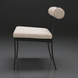 Surya Antibes Dining Chair: black aluminum frame, cream Sunbrella cushion, and cylindrical backrest.