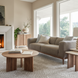 Surya Agnes round brown mango wood coffee table with beveled edge top and zigzag fluted legs.
