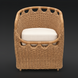 Surya Marvella indoor/outdoor dining chair with natural woven rattan and a light Sunbrella cushion.