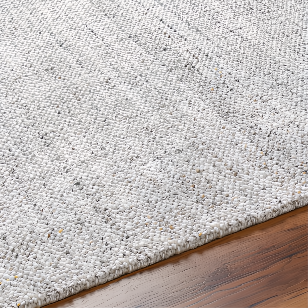 Surya Hope area rug, hand-loomed from recycled PET yarn, in white, gray, and light slate tones.