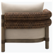 Brown woven rattan armrest and light beige cushion of a Surya Porta outdoor sectional.
