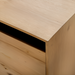 Close-up of Surya Molander Sideboard's clear natural oak veneer top and brown wood grain.