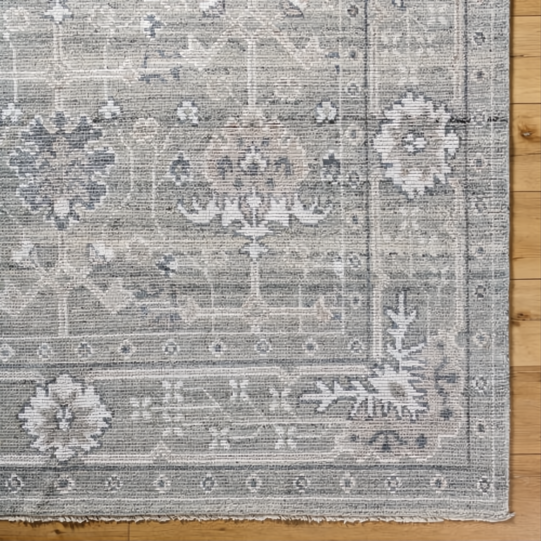 Surya Almeria low pile area rug in sage green with traditional floral and geometric patterns.