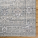 Surya Almeria low pile area rug in sage green with traditional floral and geometric patterns.