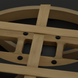 Close-up of a wheat hand-painted aluminum base with black hardware, part of an outdoor swivel chair.