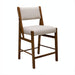 Surya Bergene dining chair with light beige upholstery and a brown natural rubber wood base.