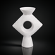 Modern white ceramic Yagya vase with a sculptural diamond shape and central circular cutout.
