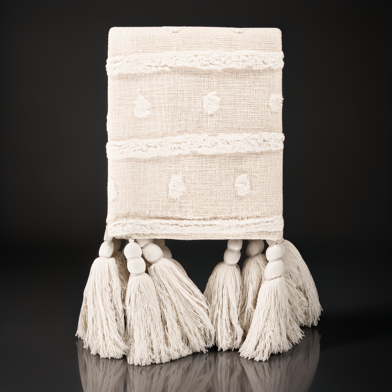 Cream Surya Dallan cotton throw with Moroccan-inspired pattern, woven texture, and decorative tassels.