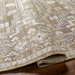Hand-knotted Surya Almeria rug with a low pile, multi-color geometric pattern in mustard, gray, and cream.