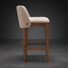 Surya Brooke counter stool with medium brown polyester upholstery and wheat-finished beechwood base.
