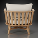 Surya Arco accent chair with light beige linen cushions and a natural wood slatted back.