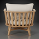 Surya Arco accent chair with light beige linen cushions and a natural wood slatted back.