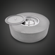 Gray hand-painted aluminum Surya Daniella Fire Table with tray cover partially open, revealing the burner.