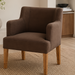 Surya Monay dining chair with chocolate brown upholstery and oak wood legs, featuring a global eclectic style.