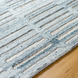 Surya Calgary CGR-2306-P area rug, hand-tufted recycled PET yarn with pale blue, dark blue, white, and light beige stripes.