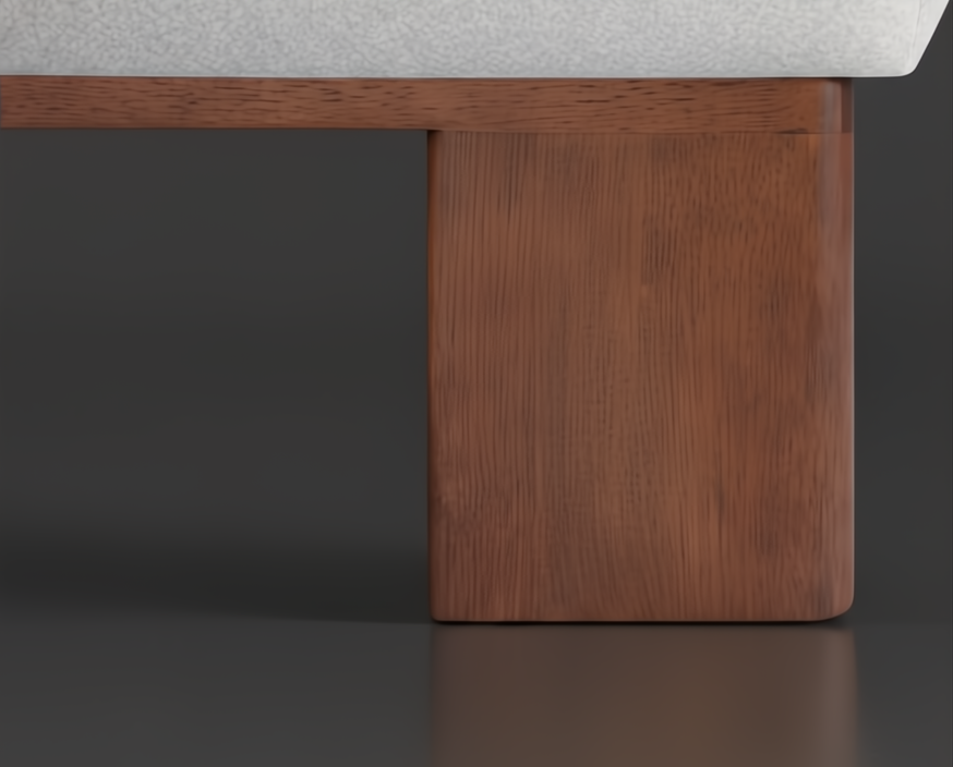 Close-up of a brown rubber wood ottoman leg with a light polyester top.