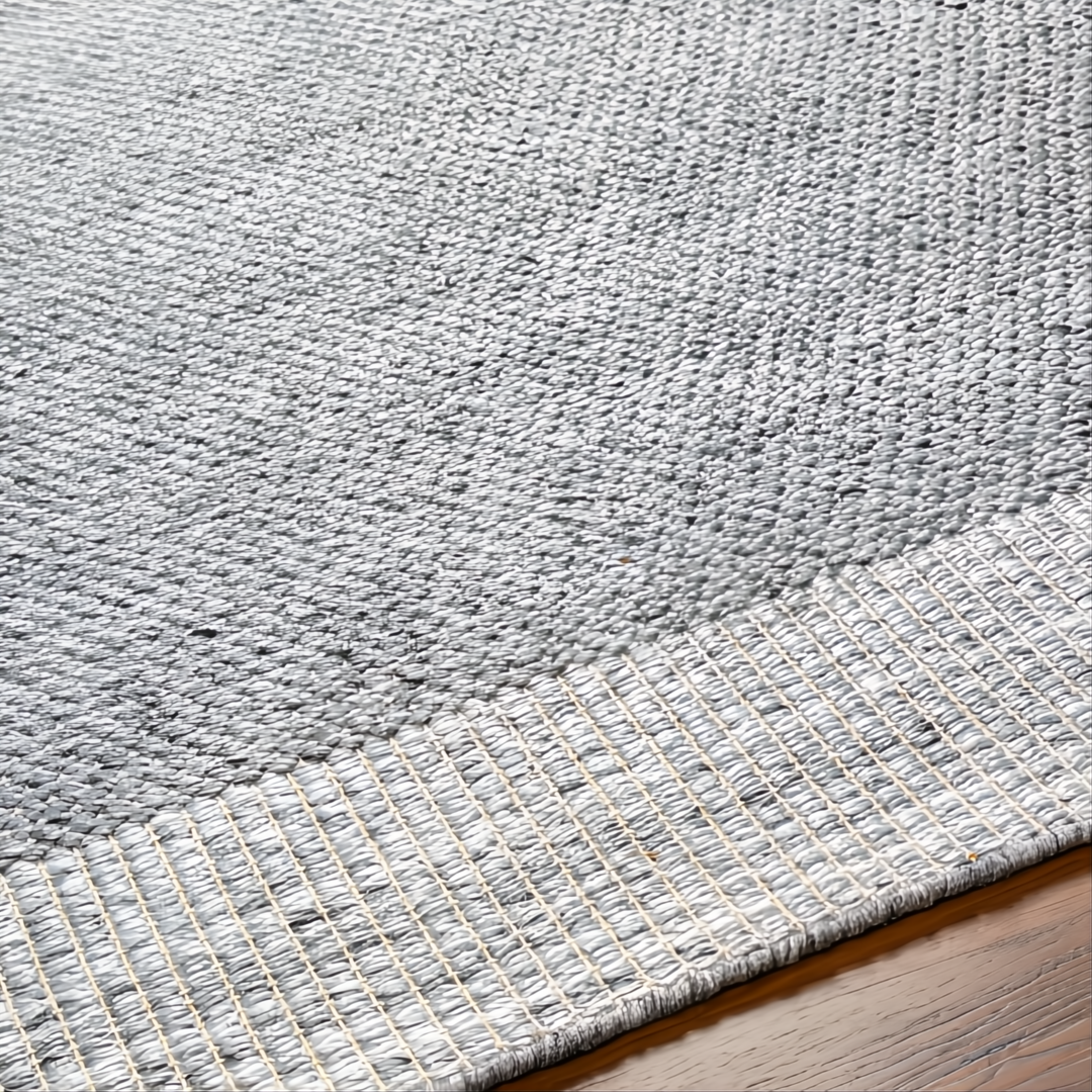Close-up of a hand-woven gray Surya Abby ABB-2300 area rug made from recycled PET yarn, showing its texture and no-pile design.