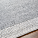 Close-up of a hand-woven gray Surya Abby ABB-2300 area rug made from recycled PET yarn, showing its texture and no-pile design.