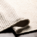 Surya Azalea AZA-2325 hand-woven ivory recycled PET yarn area rug with a textured, flatwoven design.