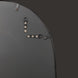 Back of a Surya Aamnah wall mirror showing black iron frame and vertical/horizontal mounting hardware.