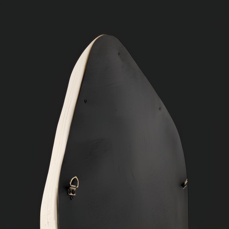 Back view of the Surya AERI-001 accent mirror, showing its specialty shape, white lacquered concrete frame, and hanging hardware.