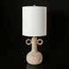 Surya Brava accent table lamp with a textured beige base, two ring handles, a white fabric shade, and gold accents.