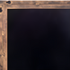 Surya Alchemist rectangular wall mirror with a hammered gold iron frame and beveled glass.