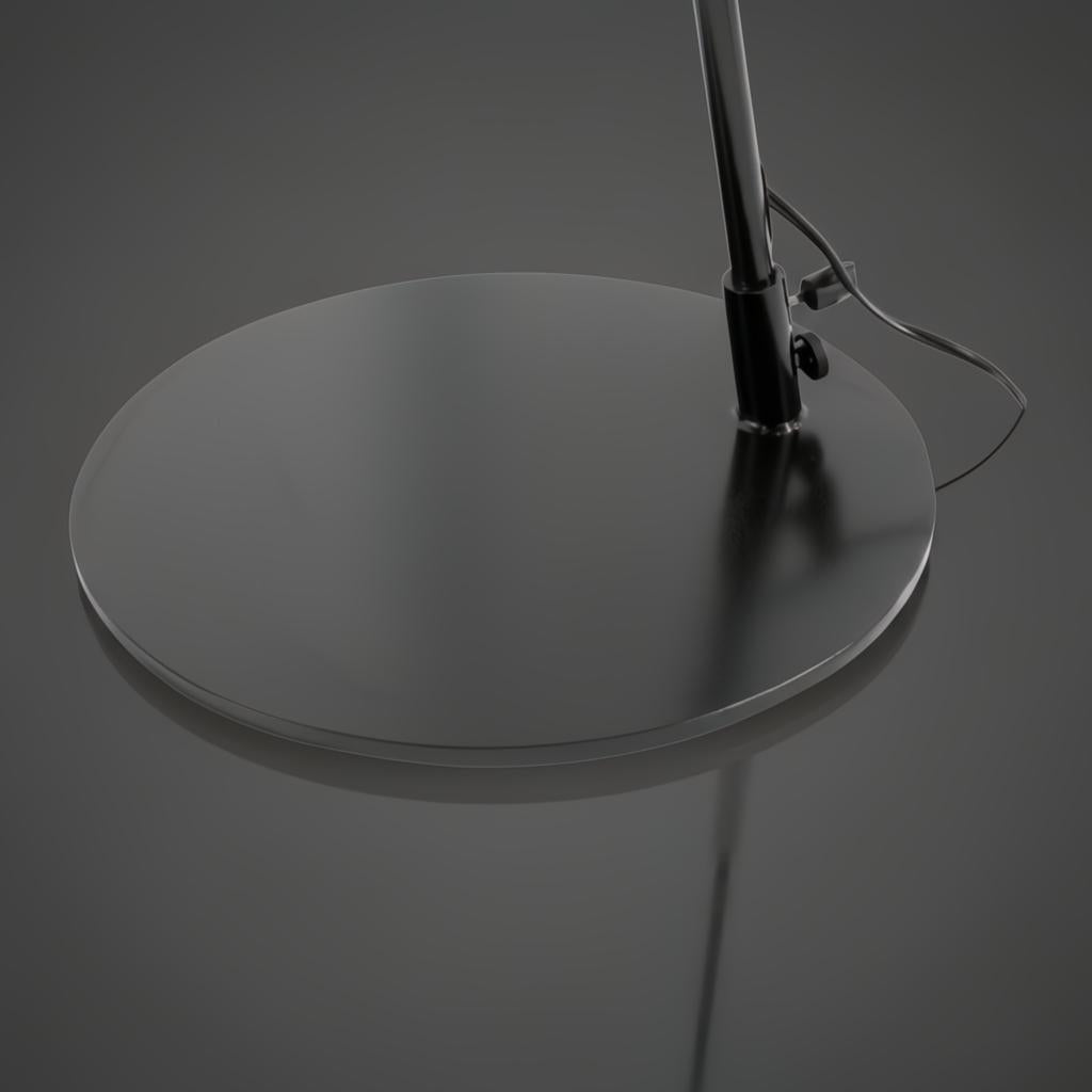 Close-up of the Astro Accent Floor Lamp's round black iron base and sleek black pole.