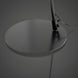Close-up of the Astro Accent Floor Lamp's round black iron base and sleek black pole.