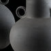 Dark grey ceramic decorative accent set with sculptural vase-like forms and textured finish.