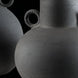 Dark grey ceramic decorative accent set with sculptural vase-like forms and textured finish.