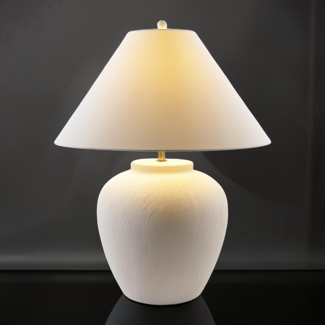 Surya Arion accent table lamp with a cream ceramic base and white linen shade.