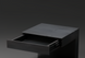 Surya Coburn black mango wood end table with a single open drawer, minimalist modern design.