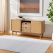 Light gray Surya Fresno FNO-2304-P area rug with subtle stripes on a light wood floor.