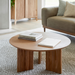 Round brown lacquered mango wood coffee table with a beveled edge top and zigzag fluted legs.