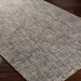 Surya Aiden wool area rug in Ink Blue and Charcoal with a textured, medium pile design.