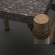 Surya Porta outdoor coffee table with charcoal matte stone top, brown aluminum legs, and PE rope detail.