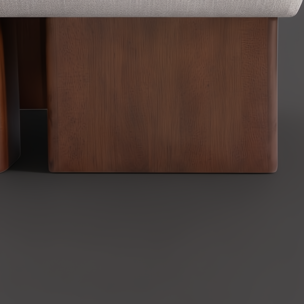 Close-up of a Surya Mirava Ottoman with an ivory polyester top and a brown stained rubber wood base.
