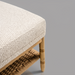 Surya Landi Bench, light beige upholstered top, natural rubber wood frame, and woven brown bottom shelf.