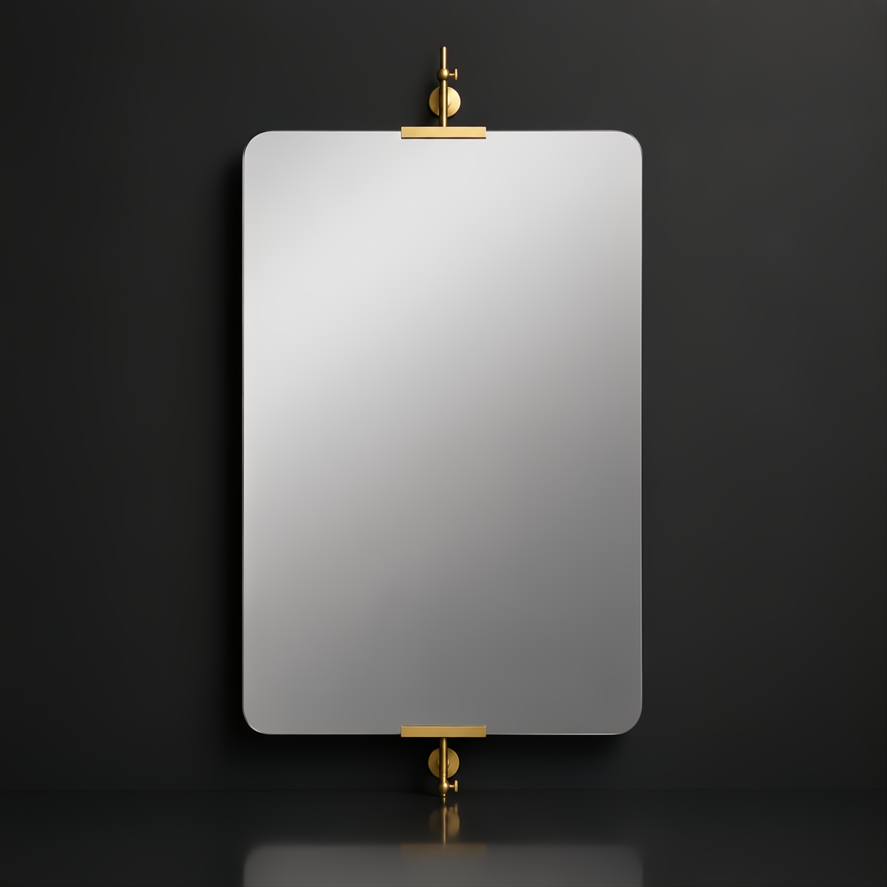 Rectangular mirror with rounded corners, suspended by brass hardware on a dark wall.