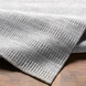 Surya Hickory HCK2302 area rug in light beige, gray, and charcoal, hand-loomed from recycled PET yarn.